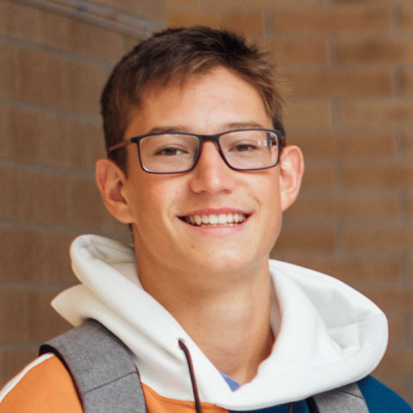 high school boy in glasses smiling