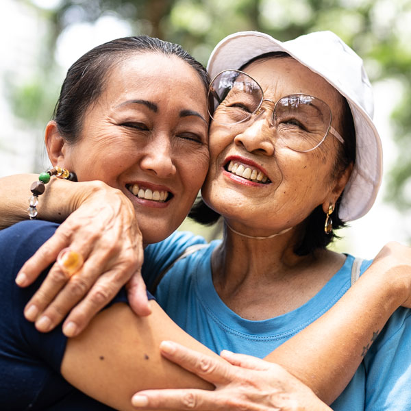 mother and daughter embracing and smiling