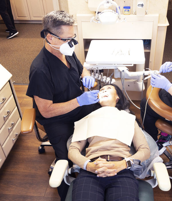 Dr. Scaff inspecting a patient's mouth