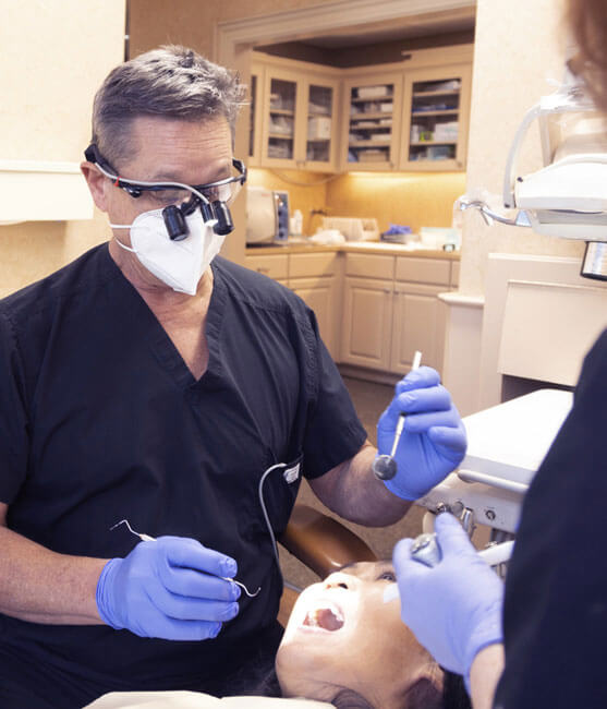 Dr. Scaff inspecting a patient's mouth