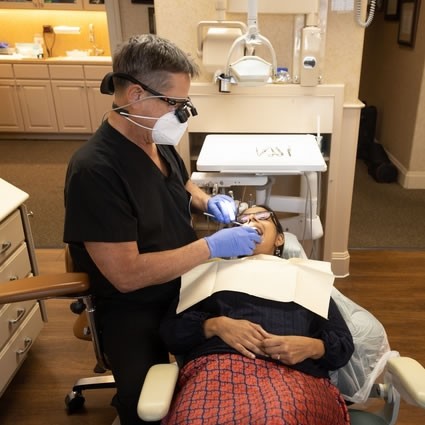 Dr. Scaff inspecting a patient's mouth