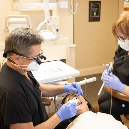 Dr. Scaff inspecting a patient's mouth