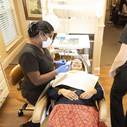 hygienists talking with patient