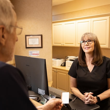 office manager talking with patient